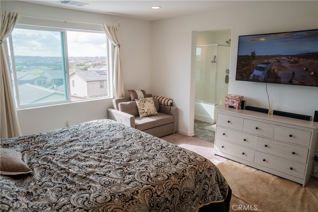 35227 Vernon Drive Beaumont, CA 92223 - Photo 27 of 49 a bedroom with a bed and window