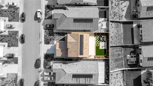 an aerial view of residential houses with outdoor space