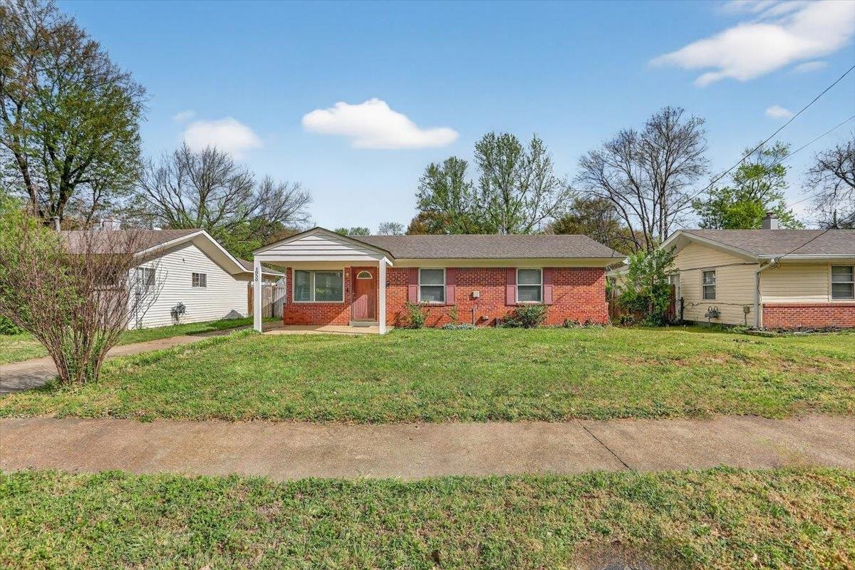 4850 Marcel Avenue Memphis, TN 38122 - Photo 1 of 20 Ranch-style house with a front lawn, brick siding, and covered porch