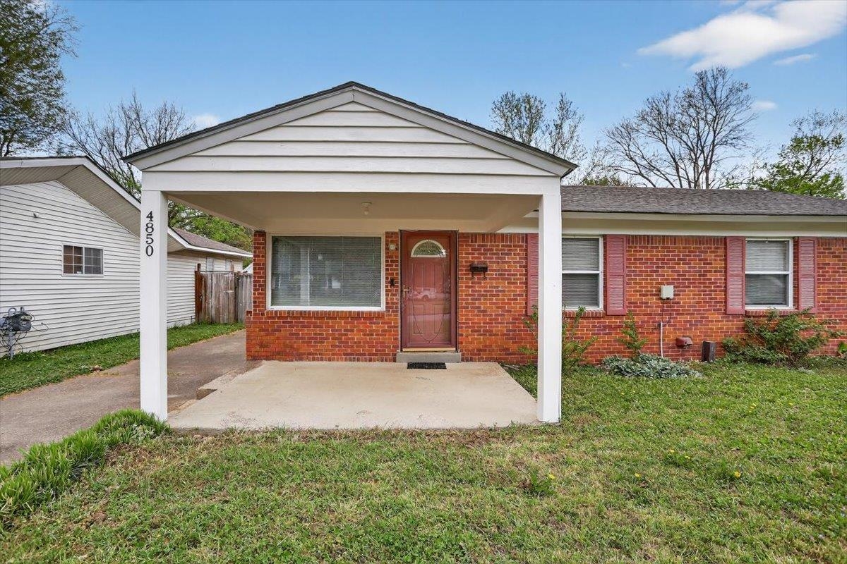 4850 Marcel Avenue Memphis, TN 38122 - Photo 3 of 20 View of front of home featuring brick siding and covered porch