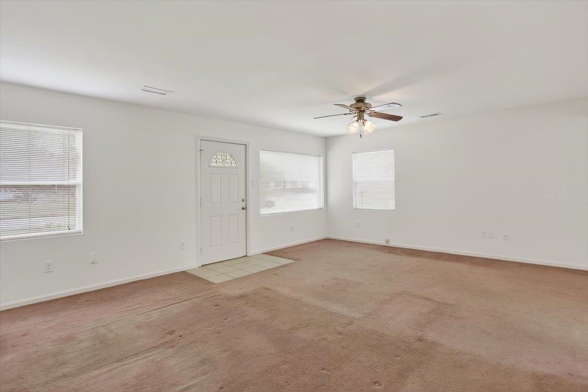 4850 Marcel Avenue Memphis, TN 38122 - Photo 7 of 20 Entrance foyer featuring ceiling fan and carpet flooring