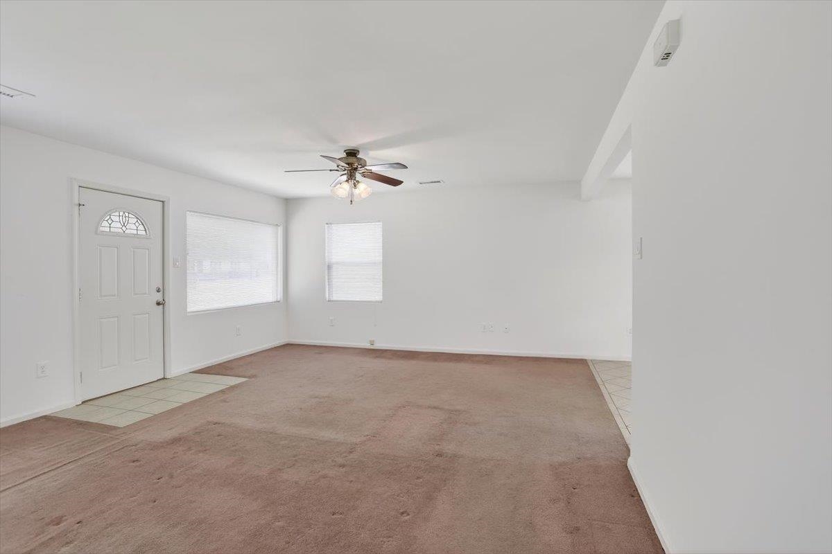 4850 Marcel Avenue Memphis, TN 38122 - Photo 8 of 20 Entrance foyer featuring light colored carpet and ceiling fan