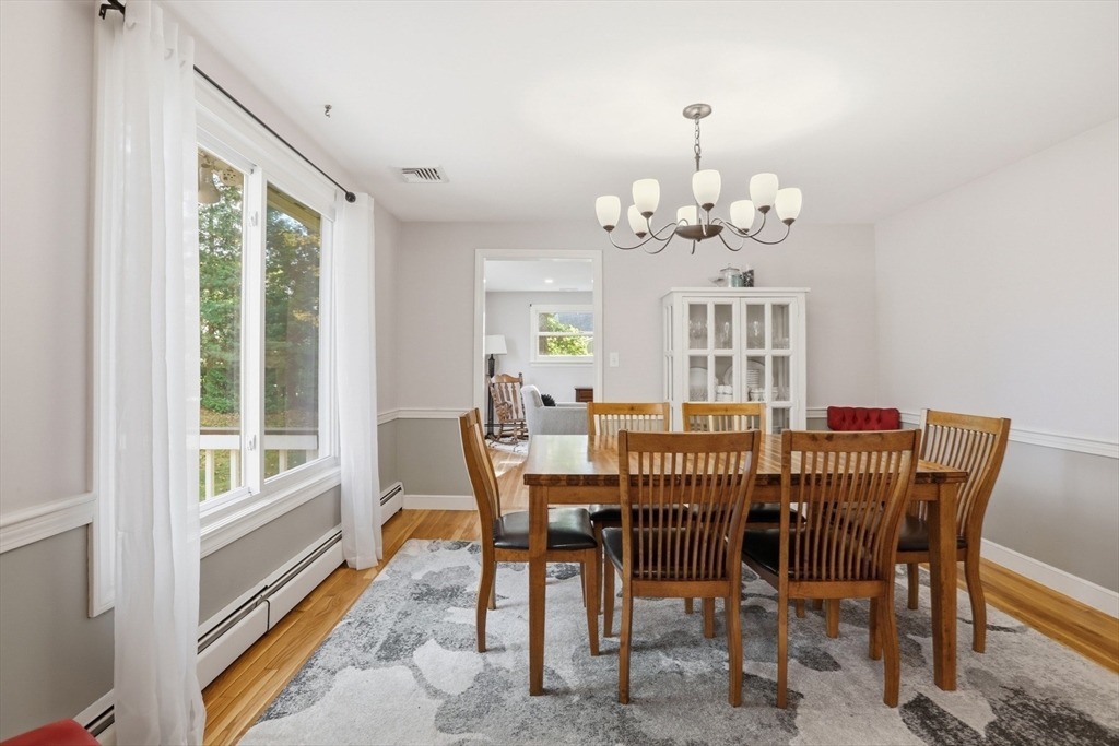 5 Carnegie Place Lexington, MA 02420 - Photo 11 of 39 a view of a dining room with furniture window and outside view