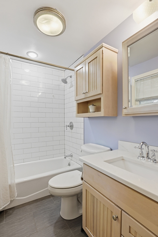 5 Carnegie Place Lexington, MA 02420 - Photo 16 of 39 a bathroom with a sink a toilet and shower