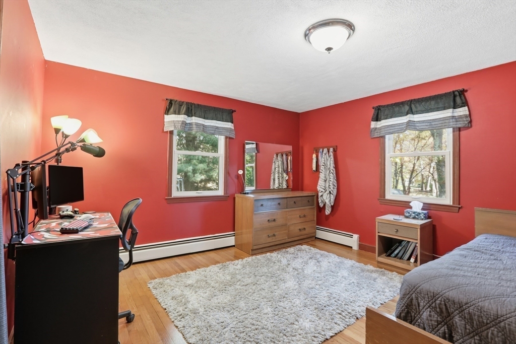 5 Carnegie Place Lexington, MA 02420 - Photo 17 of 39 a bedroom with furniture and a window