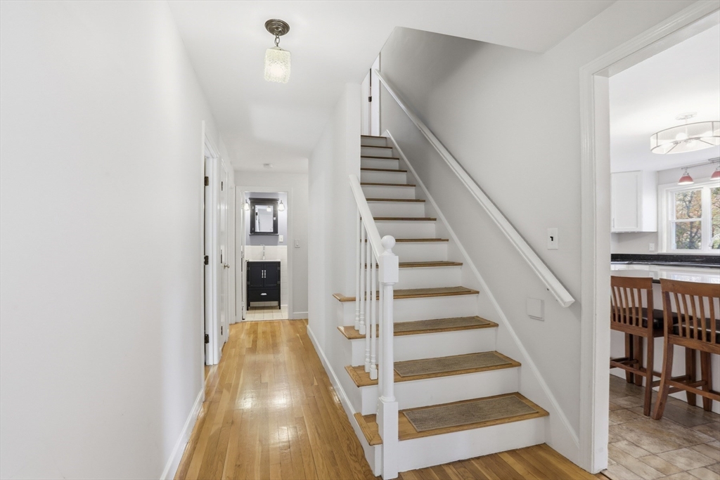 5 Carnegie Place Lexington, MA 02420 - Photo 20 of 39 a view of a hallway with wooden floor and entryway