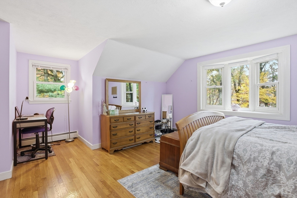 5 Carnegie Place Lexington, MA 02420 - Photo 24 of 39 a bedroom with a bed and a desk