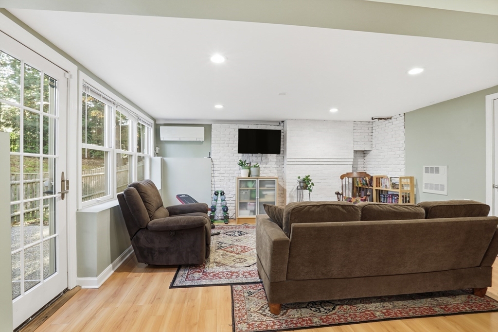 5 Carnegie Place Lexington, MA 02420 - Photo 26 of 39 a living room with furniture and a flat screen tv