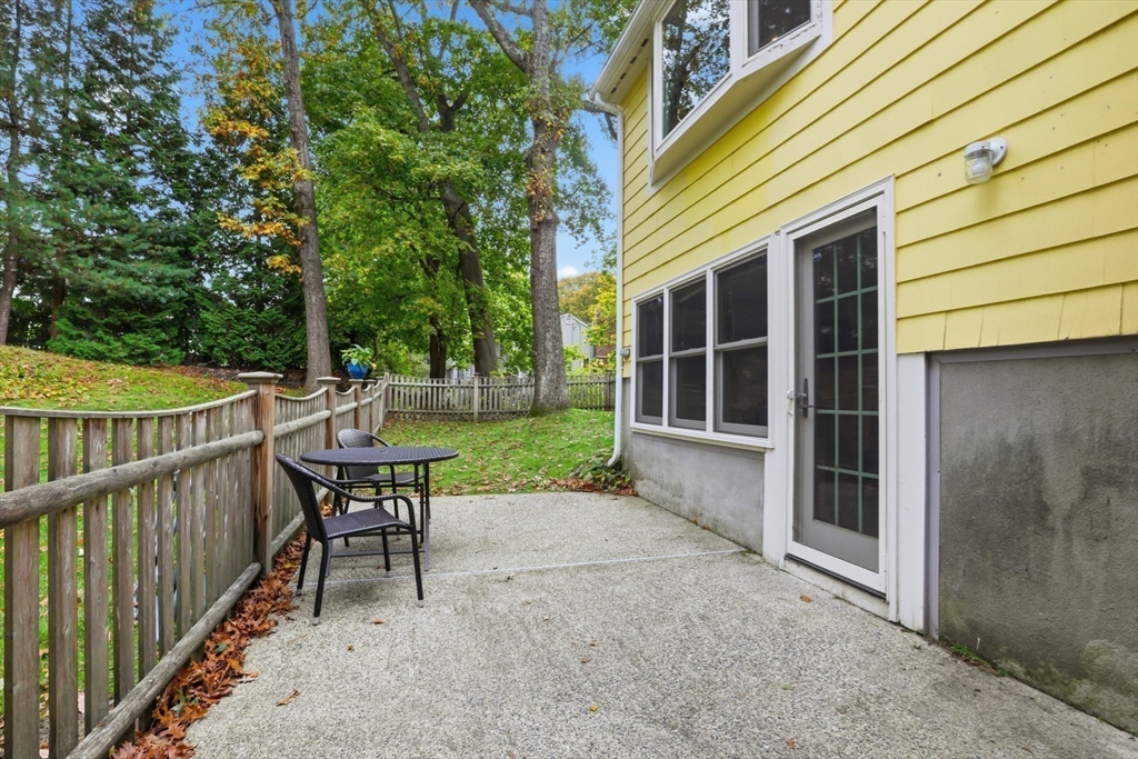 5 Carnegie Place Lexington, MA 02420 - Photo 32 of 39 a view of a house with backyard and sitting area