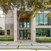 a view of a brick building next to a yard