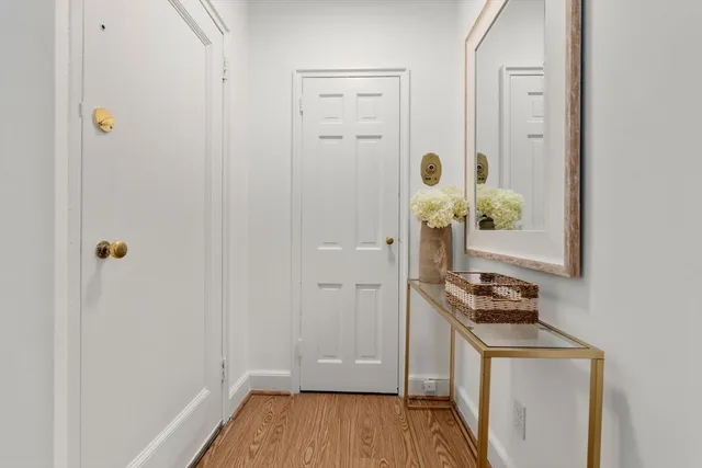 a room that has a stove and a wooden floor