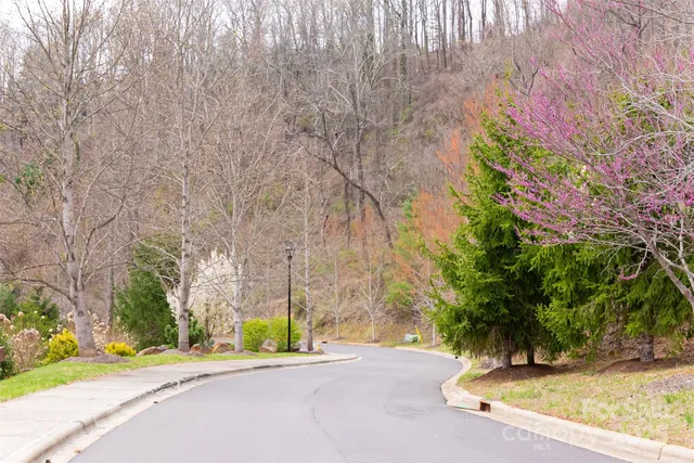 a view of a bench in a sidewalk