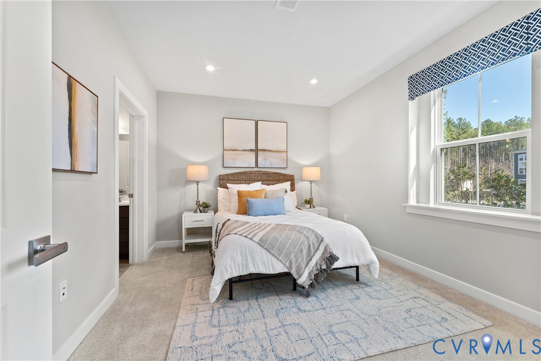 6601 Citory Way, Unit 106 Moseley, VA 23120 - Photo 15 of 39 a bed room with a bed and a window