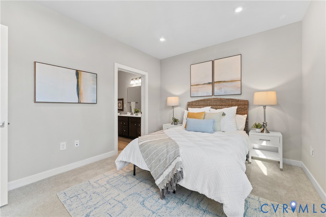 6601 Citory Way, Unit 106 Moseley, VA 23120 - Photo 16 of 39 a bedroom with a bed and a lamp