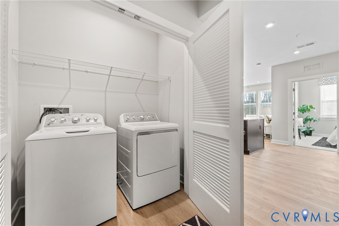 6601 Citory Way, Unit 106 Moseley, VA 23120 - Photo 23 of 39 a utility room with dryer and washer
