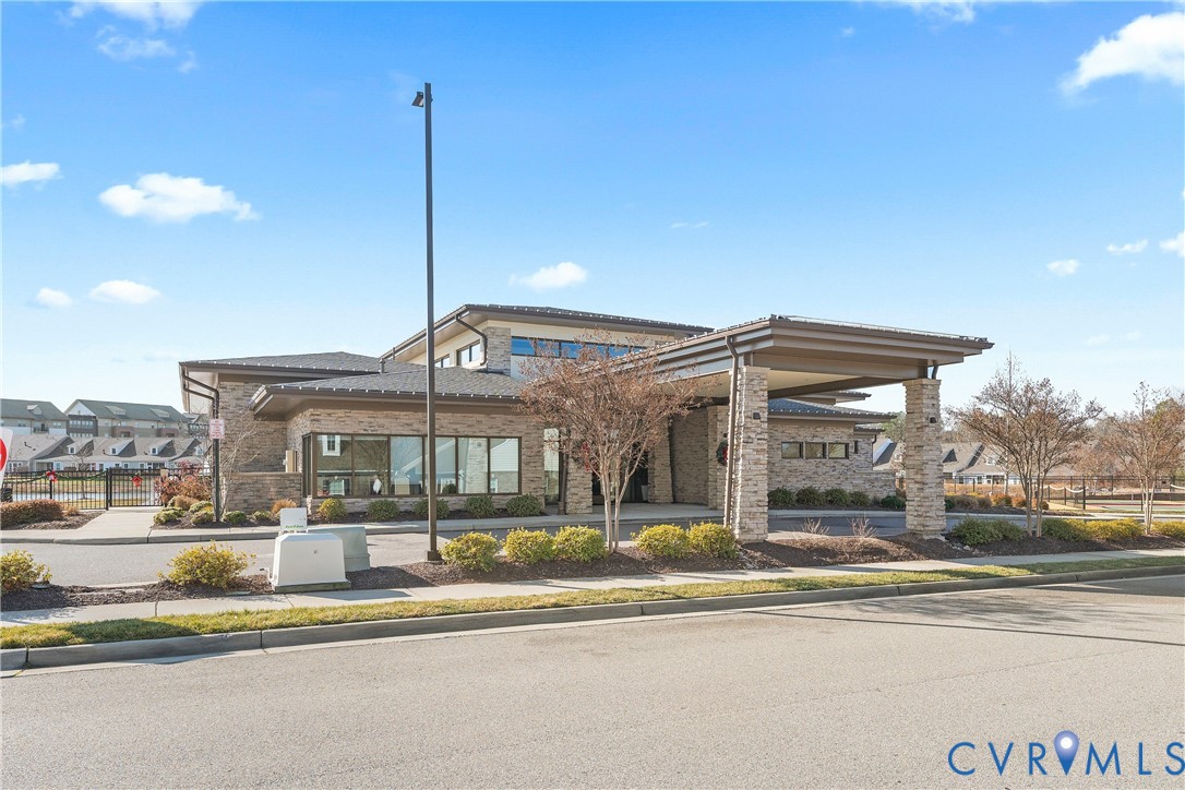 6601 Citory Way, Unit 106 Moseley, VA 23120 - Photo 25 of 39 a view of a building with a garden