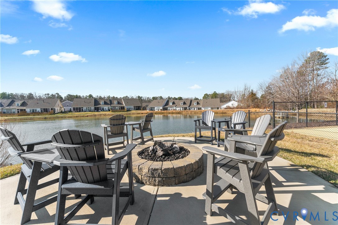 6601 Citory Way, Unit 106 Moseley, VA 23120 - Photo 36 of 39 a view of a chairs and table on the terrace