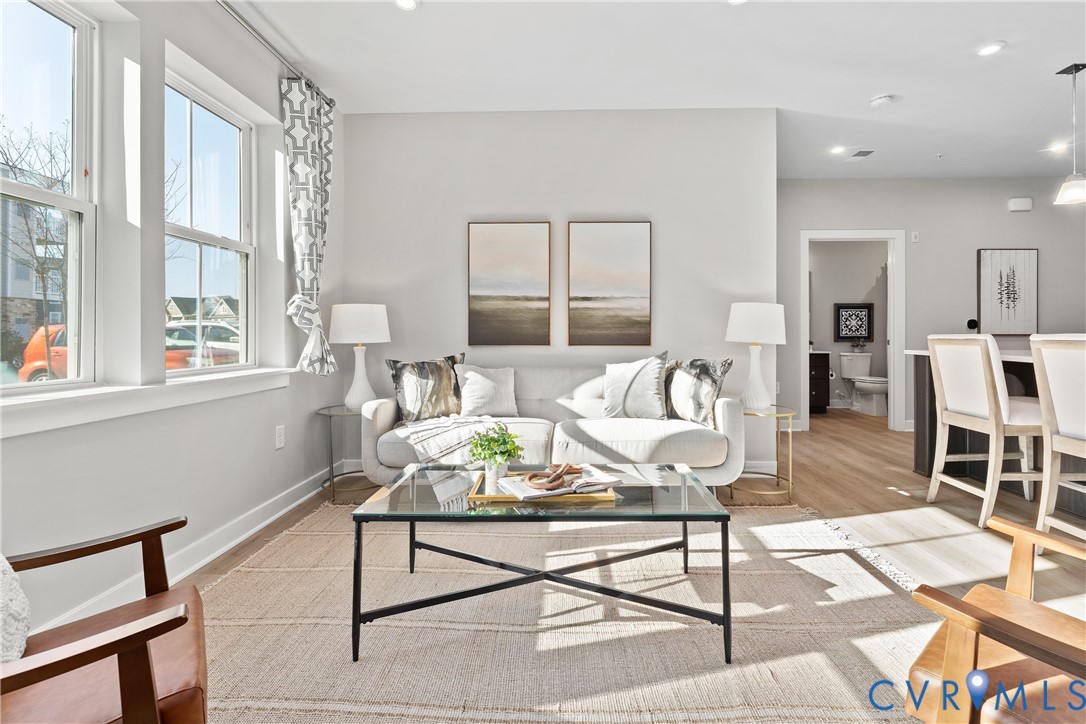 6601 Citory Way, Unit 106 Moseley, VA 23120 - Photo 5 of 39 a living room with furniture and a window