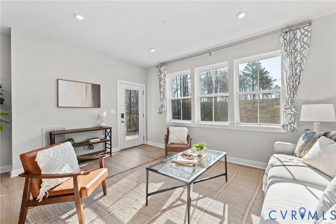 6601 Citory Way, Unit 106 Moseley, VA 23120 - Photo 6 of 39 a living room with furniture and a window