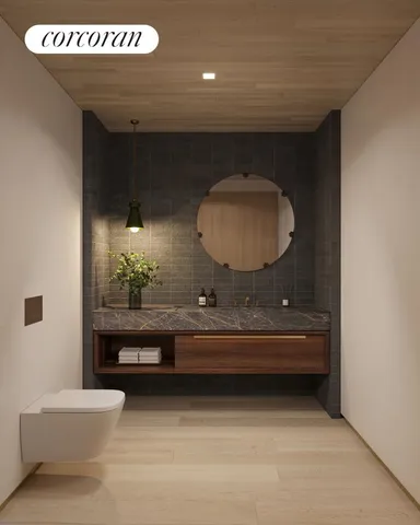 a bathroom with a toilet sink and mirror