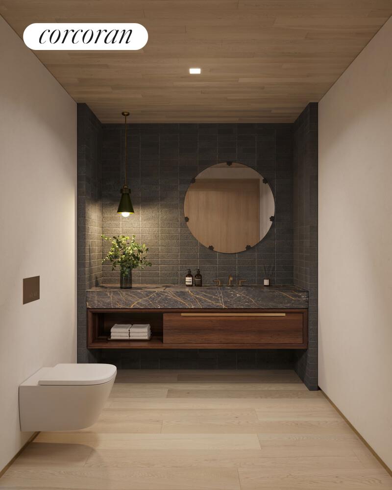 140 Jane Street, Unit 2S Manhattan, NY 10014 - Photo 7 of 13 a bathroom with a sink and a mirror