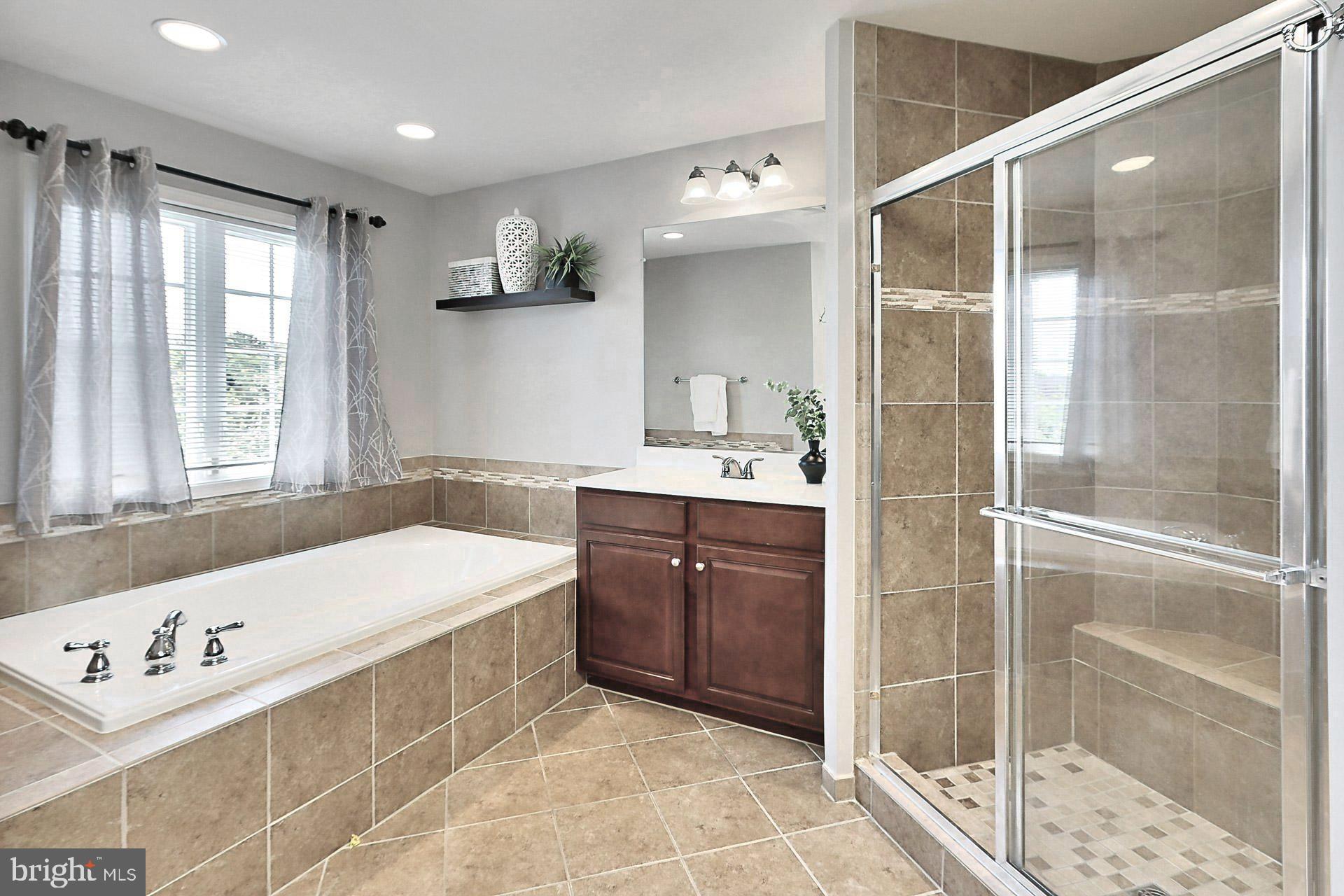 42395 Rising Moon Place Brambleton, VA 20148 - Photo 23 of 82 Neutral Tile and Private Water Closet