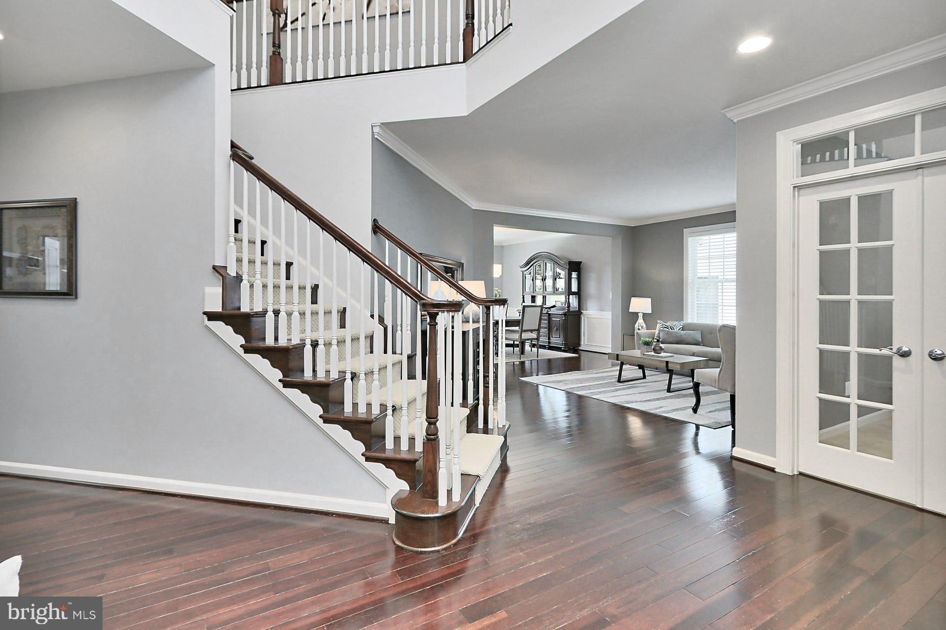42395 Rising Moon Place Brambleton, VA 20148 - Photo 3 of 82 Enjoy the 2 Story Foyer w/ Turned Staircase