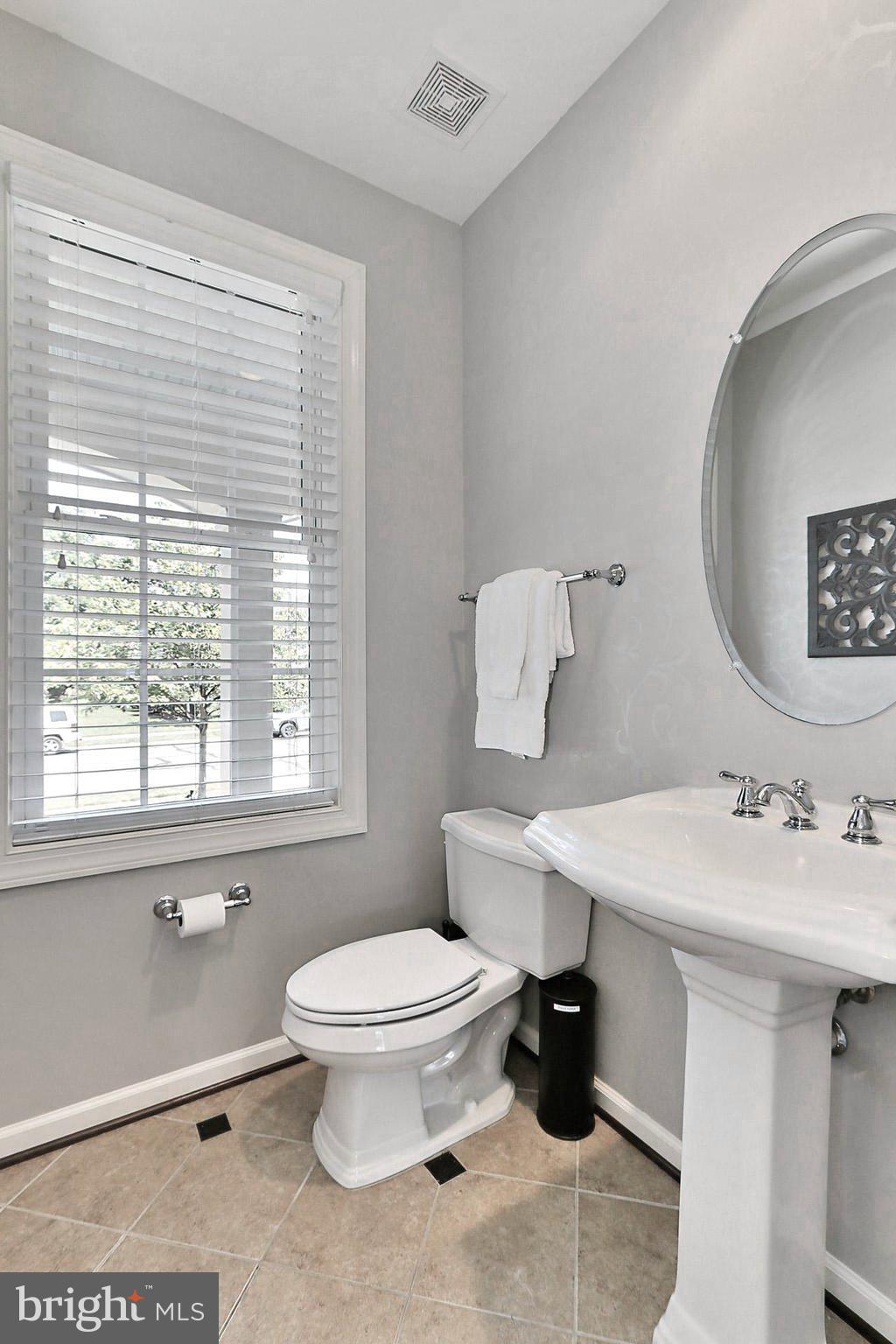 42395 Rising Moon Place Brambleton, VA 20148 - Photo 5 of 82 Main Lvl Half Bathroom w/ Neutral Tile and Inlay