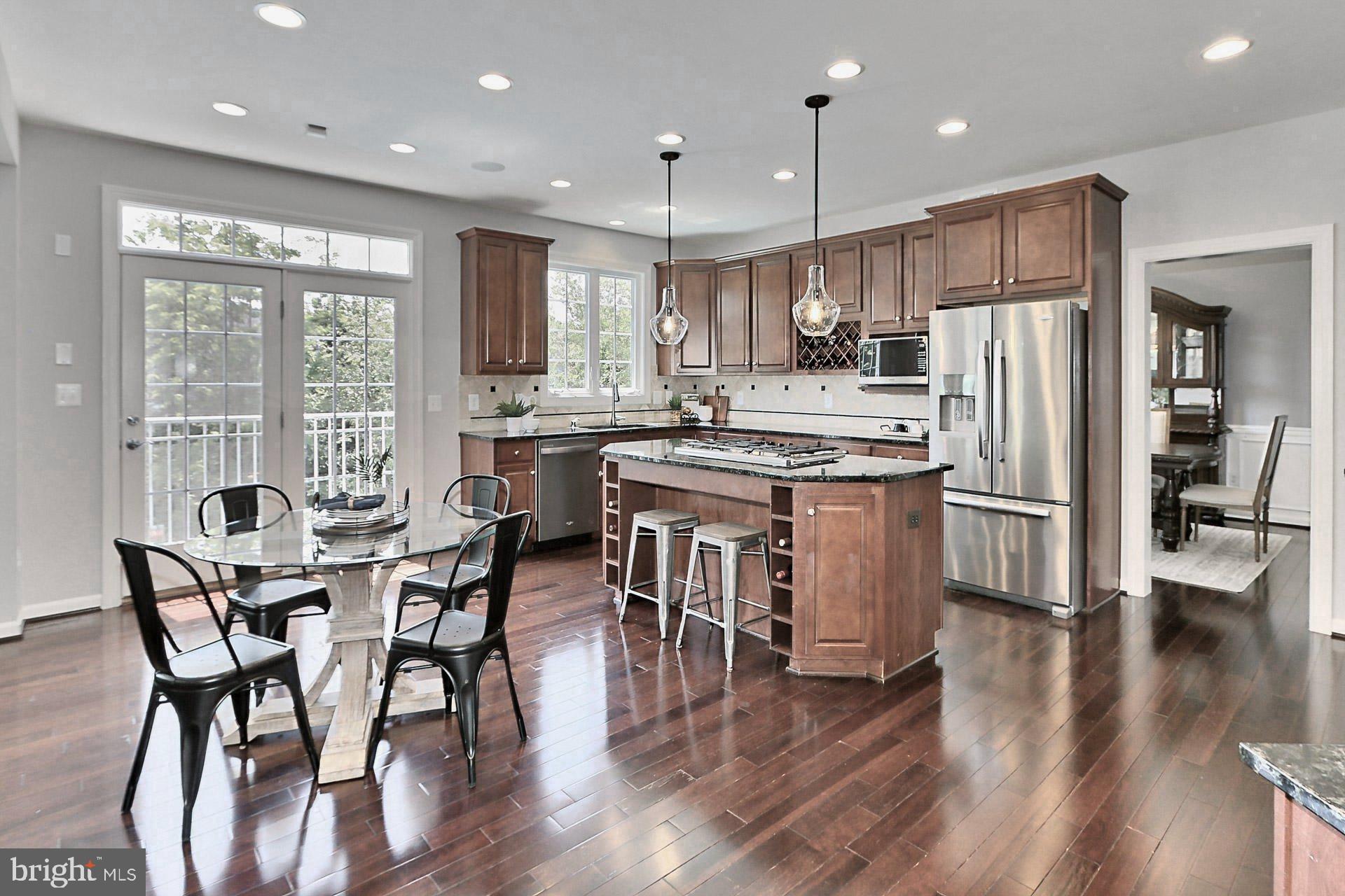 42395 Rising Moon Place Brambleton, VA 20148 - Photo 9 of 82 Spacious Gourmet Kitchen w/ SS Appliances