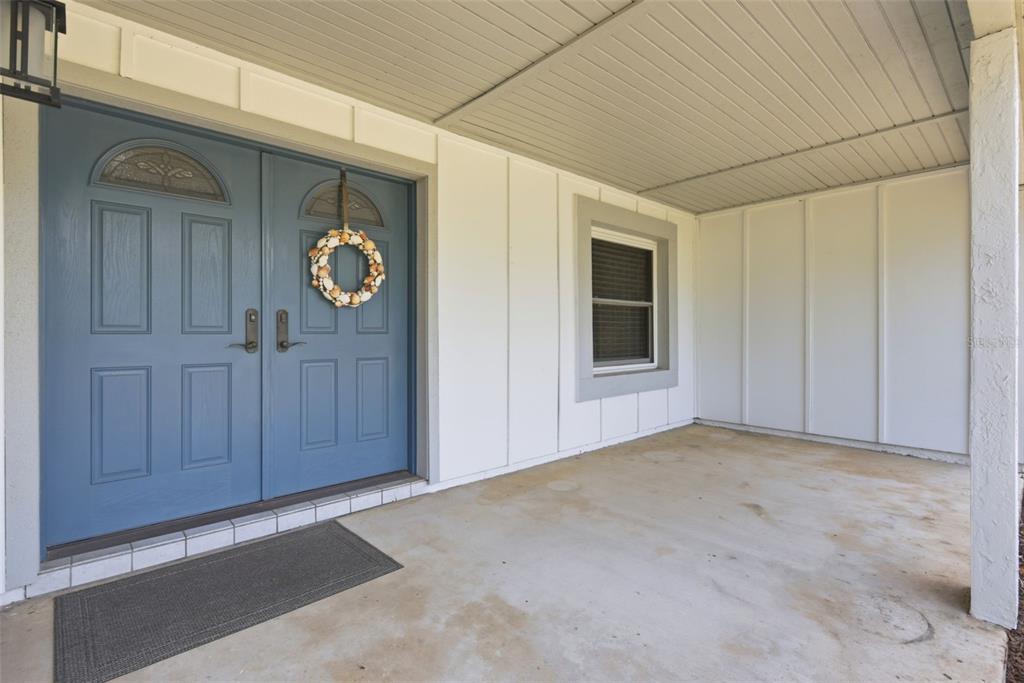 7432 Sparkling Lake Road Orlando, FL 32819 - Photo 4 of 54 a view of an entryway with wooden floor