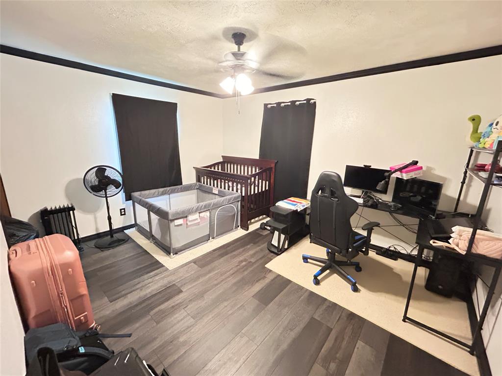 104 Gaskins Street Como, TX 75431 - Photo 11 of 15 a living room with furniture a flat screen tv and a window