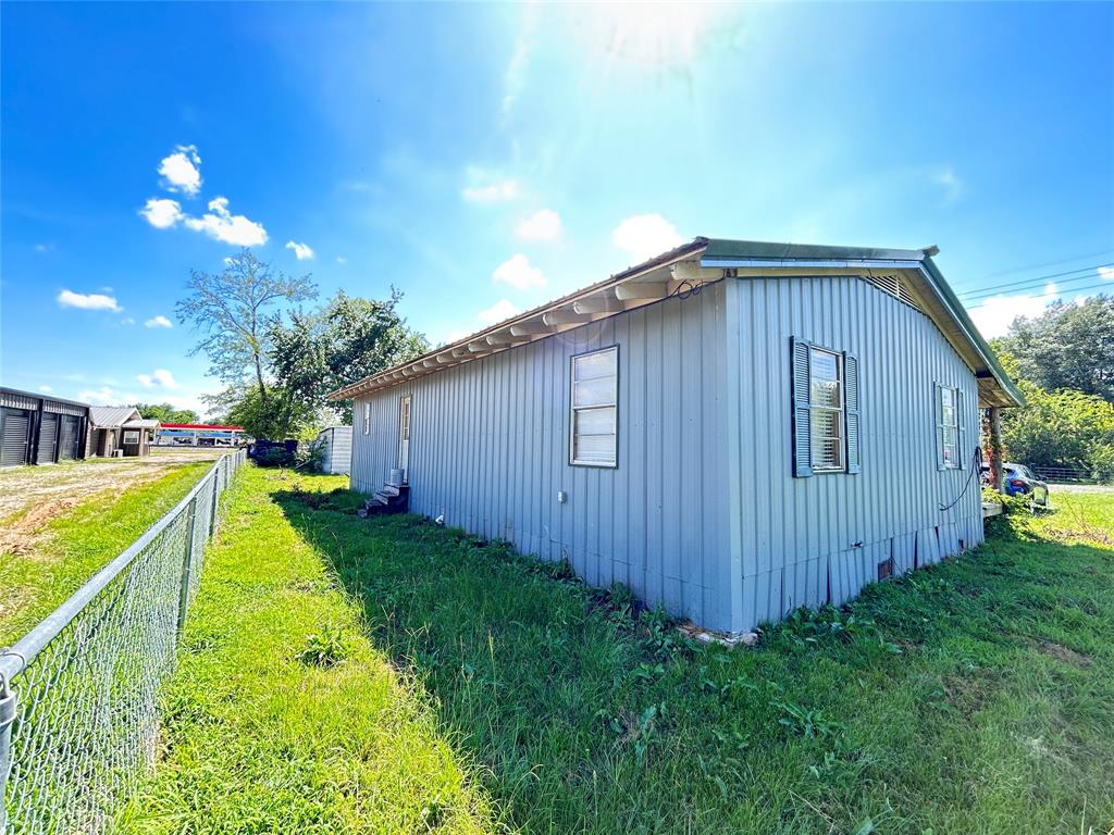 104 Gaskins Street Como, TX 75431 - Photo 13 of 15 a view of an house with backyard space and balcony
