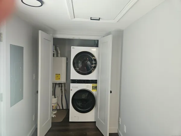 a view of a hallway with washer and dryer