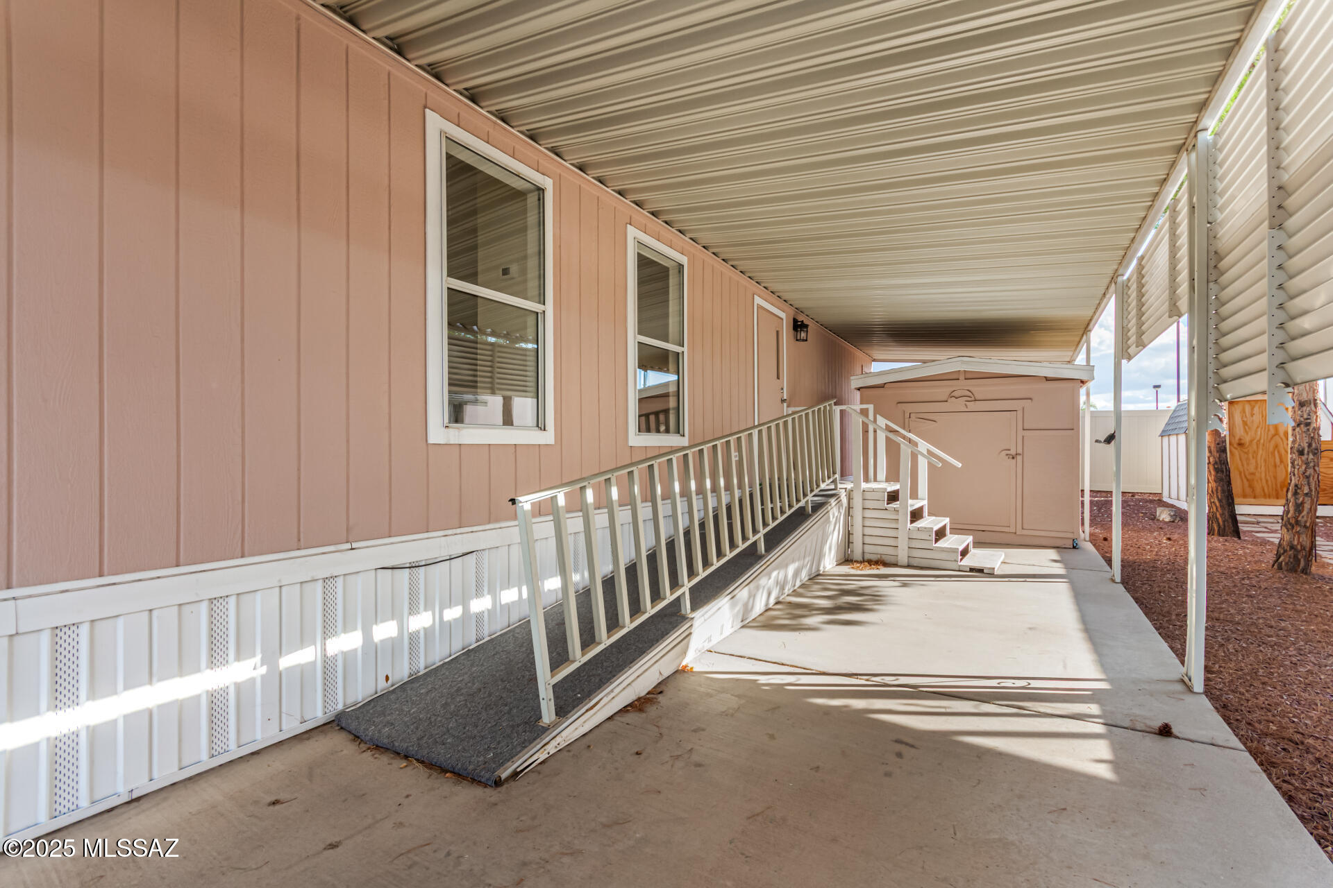 8401 South Kolb Road, Unit 94 Tucson, AZ 85756 - Photo 4 of 24 a view of a porch with wooden floor and stairs
