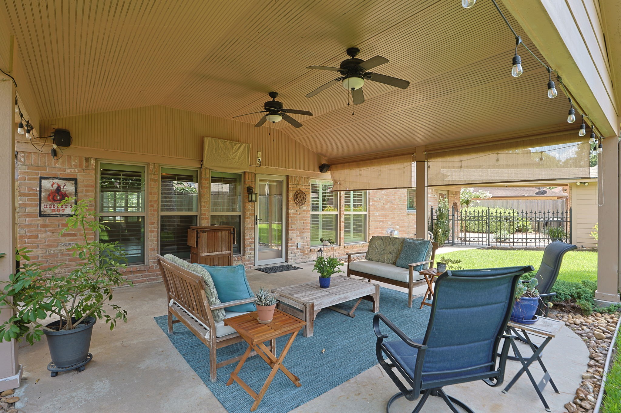 3414 Flaming Candle Drive Spring, TX 77388 - Photo 39 of 50 COVERED PATIO - This beautiful, covered patio provides a great outdoor living space. The ceiling fans make it comfortable. There are shades on the west side that can be lowered to protect from the sun. The TV mounted above the window can remain with the home.
