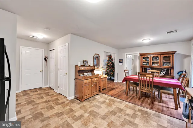 a living room with furniture a window and a flat screen tv