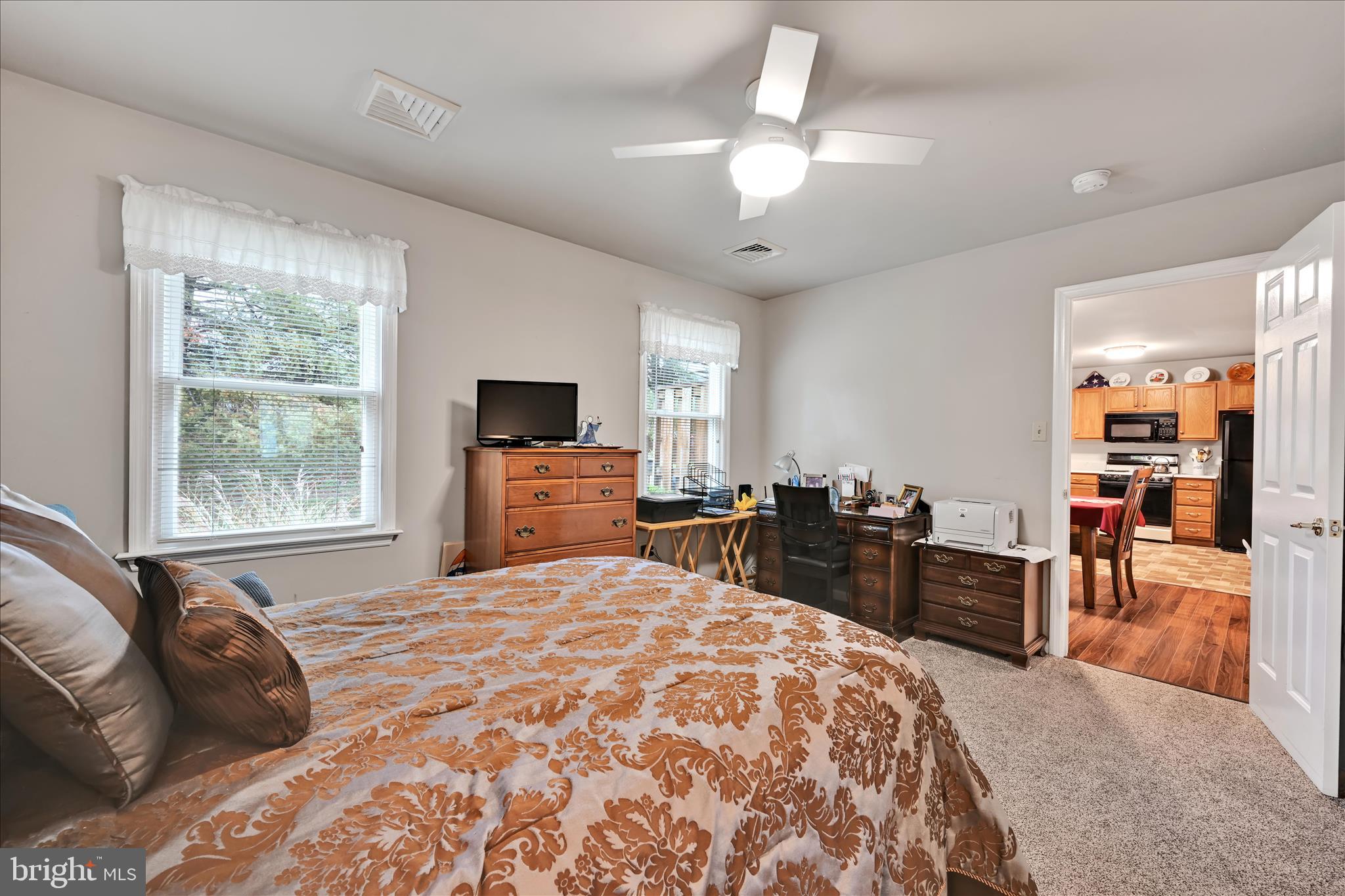 32 Knollwood Road Millersville, PA 17551 - Photo 16 of 28 a bedroom with a bed and a chandelier