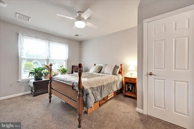 a bed room with a bed and a chandelier