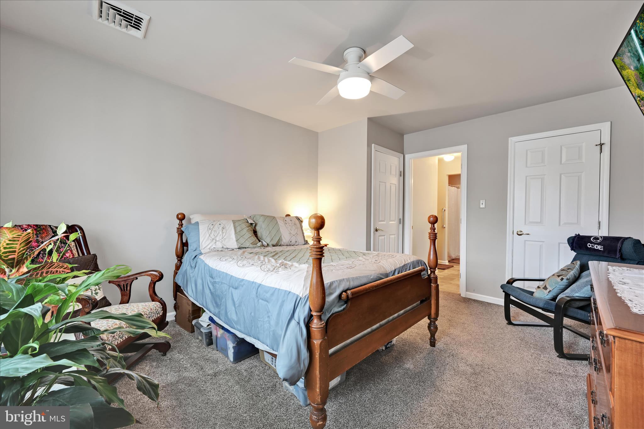 32 Knollwood Road Millersville, PA 17551 - Photo 21 of 28 a bed room with a bed and a chandelier