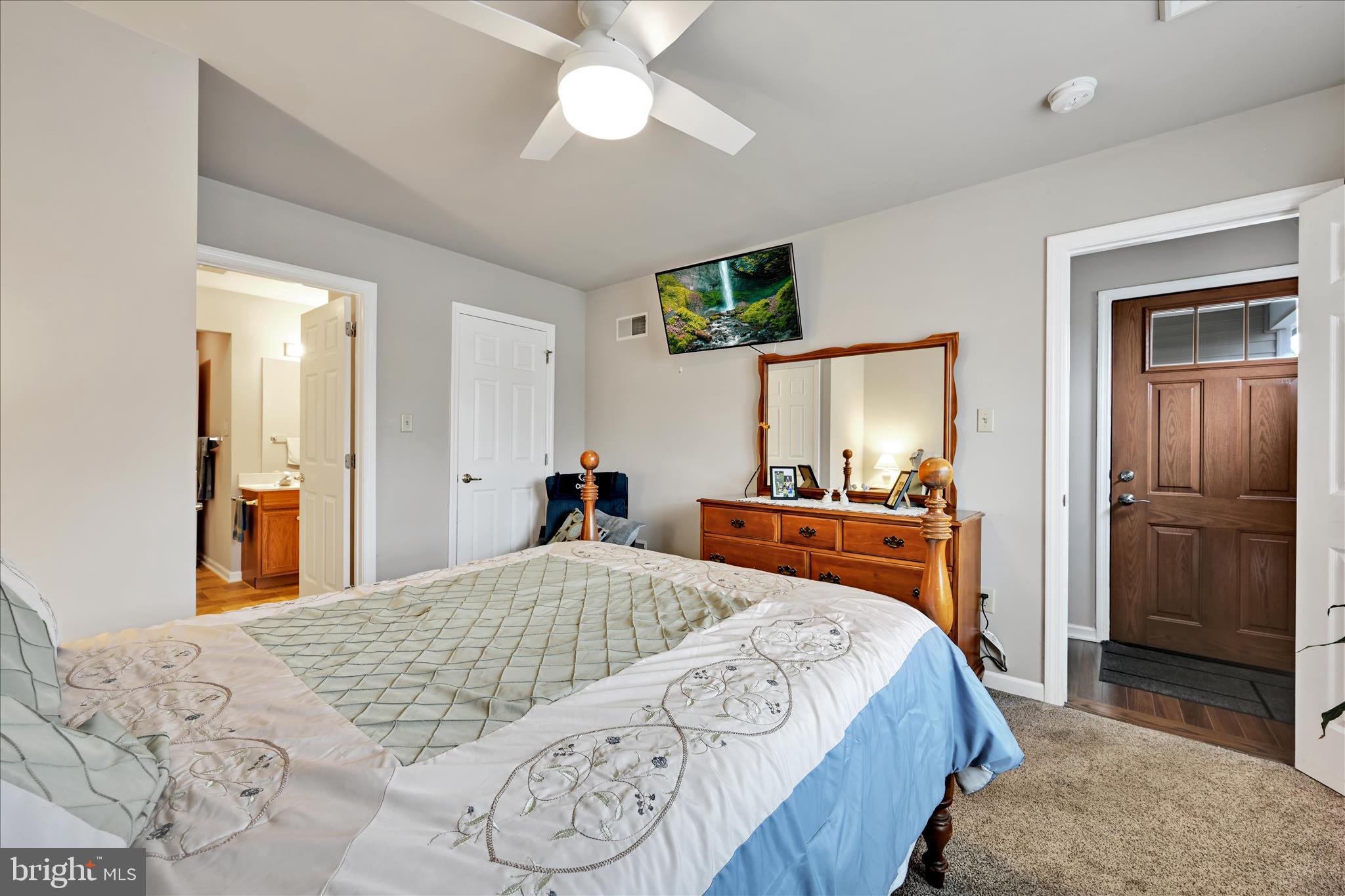 32 Knollwood Road Millersville, PA 17551 - Photo 22 of 28 a bedroom with a bed and a dresser in it