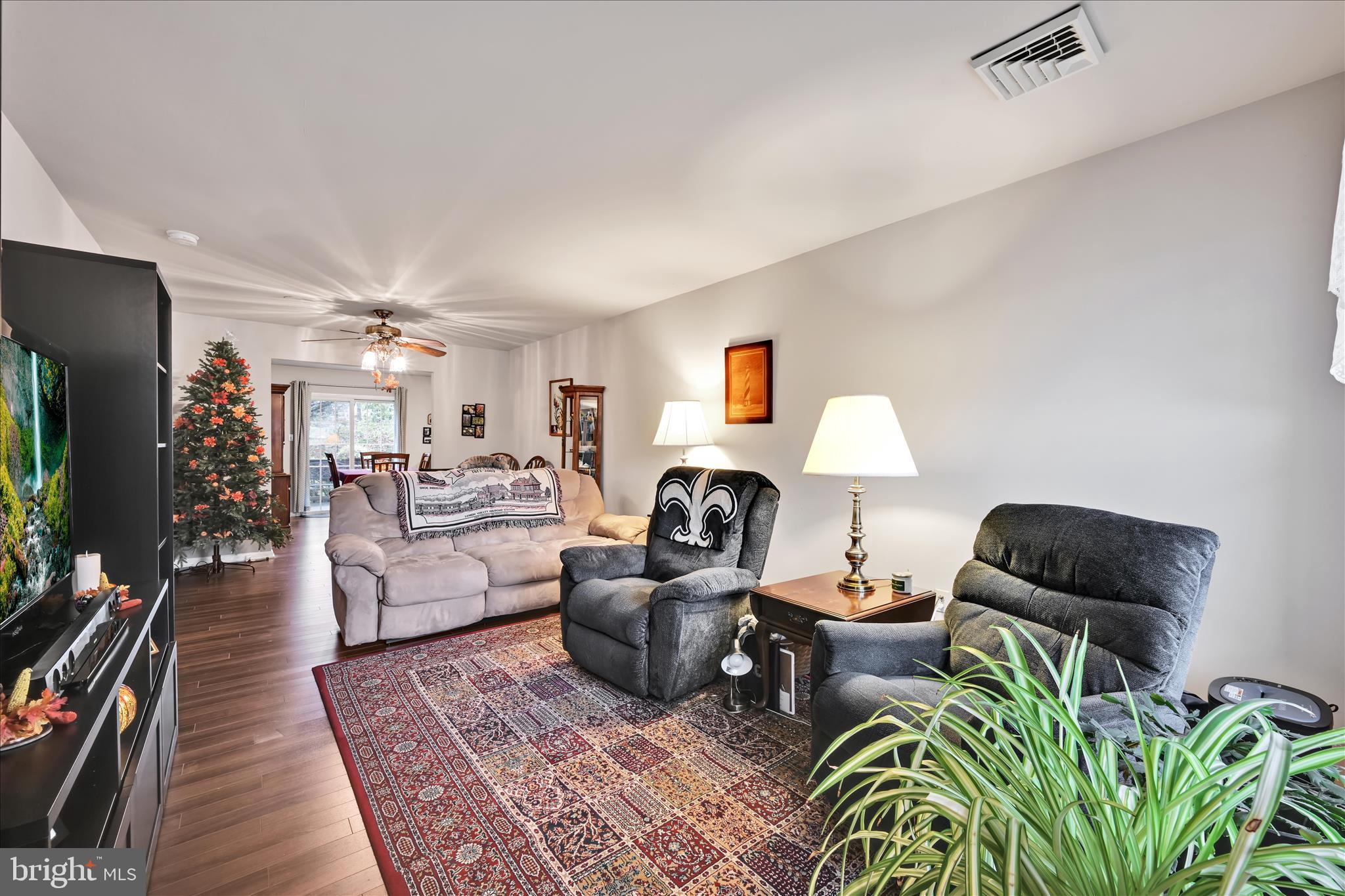 32 Knollwood Road Millersville, PA 17551 - Photo 5 of 28 a living room with furniture a flat screen tv and a fireplace