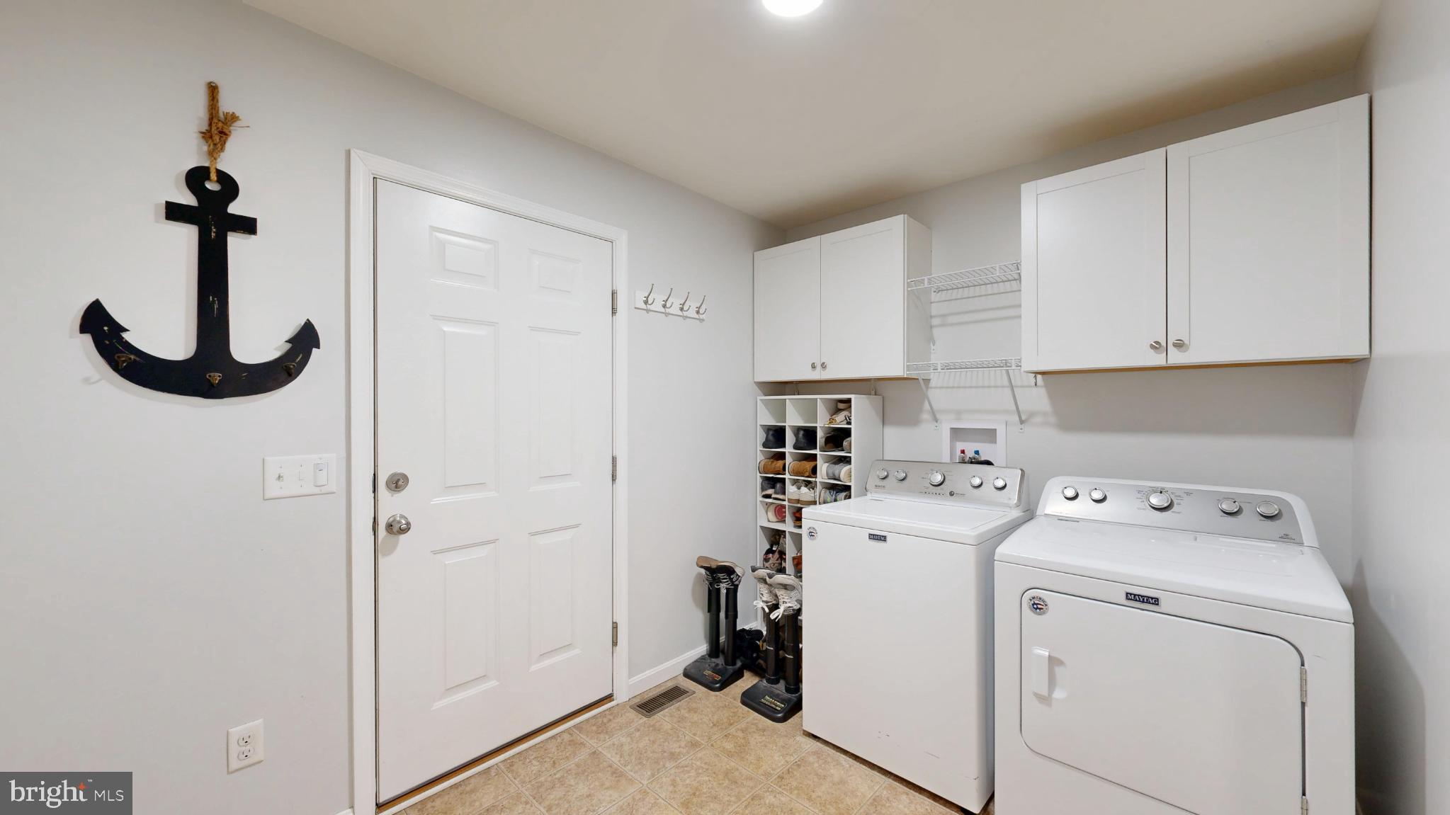 202 East Buck Point Road Clayton, DE 19938 - Photo 14 of 53 a view of storage and utility room with washer and dryer