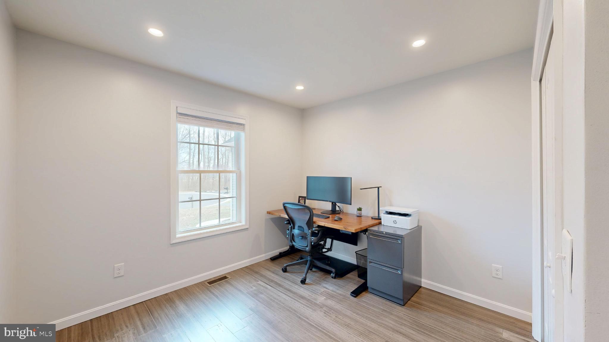202 East Buck Point Road Clayton, DE 19938 - Photo 21 of 53 a workspace with furniture and a window