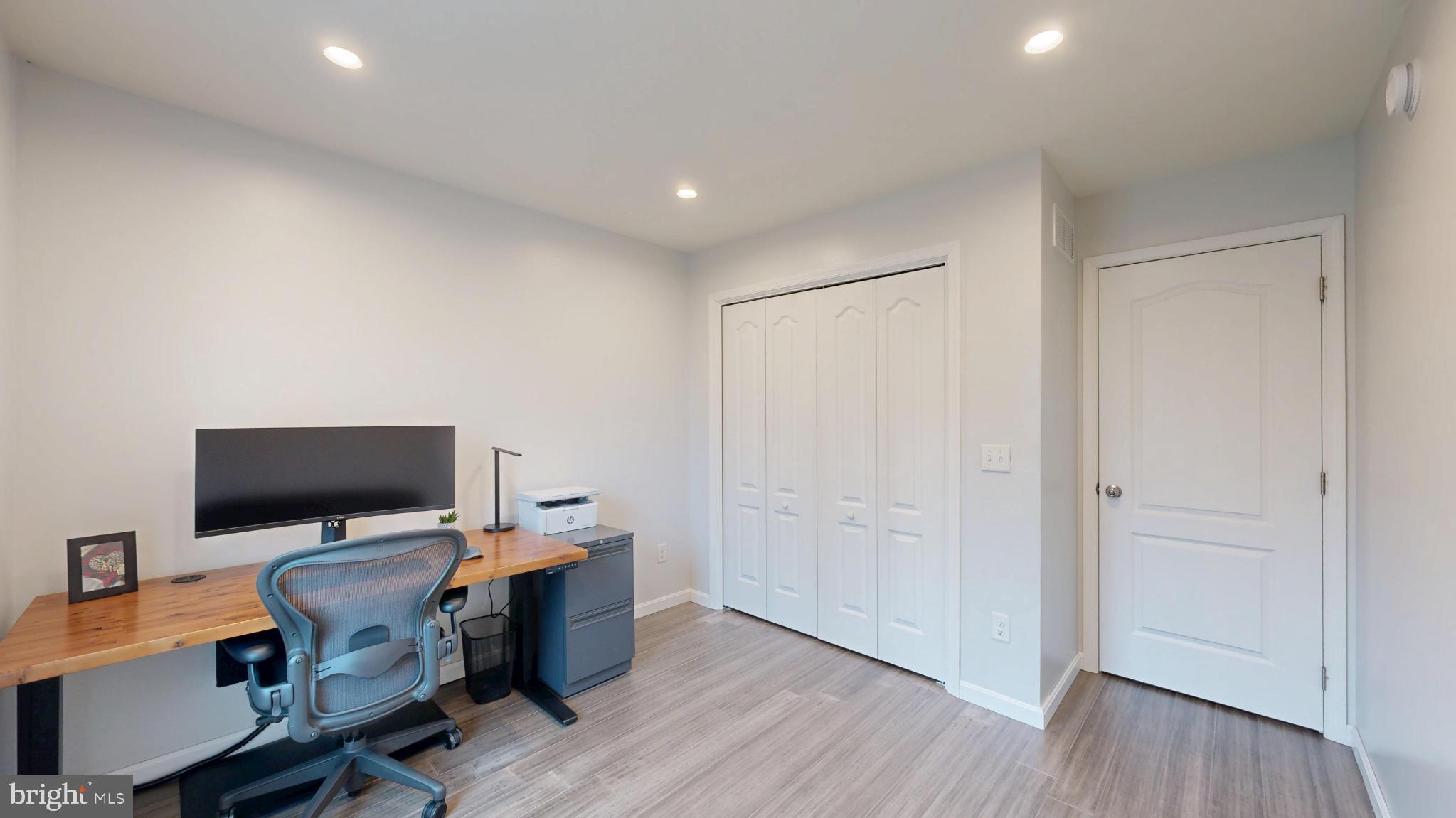 202 East Buck Point Road Clayton, DE 19938 - Photo 22 of 53 a view of a workspace with furniture and wooden floor