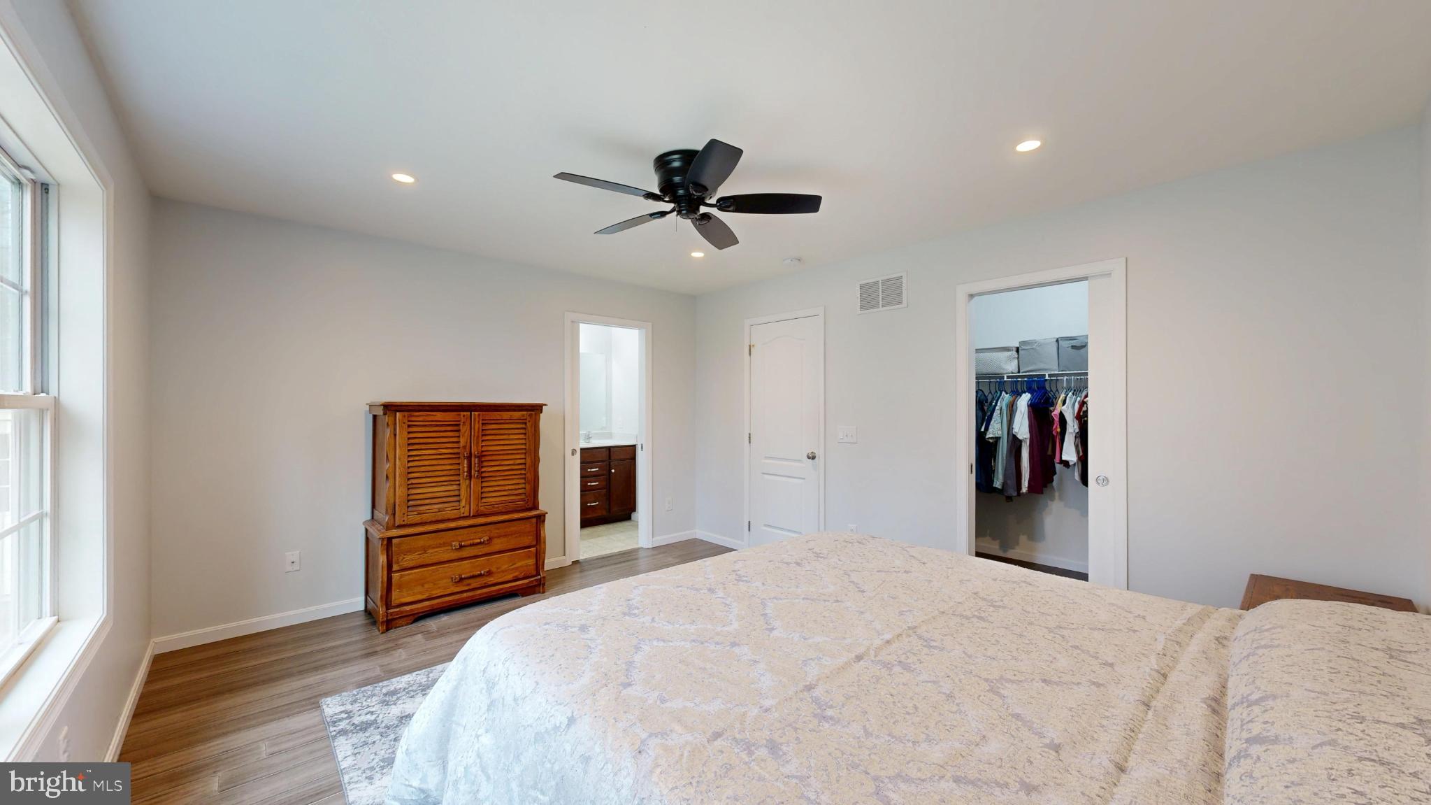 202 East Buck Point Road Clayton, DE 19938 - Photo 27 of 53 a bedroom with a bed and a chandelier