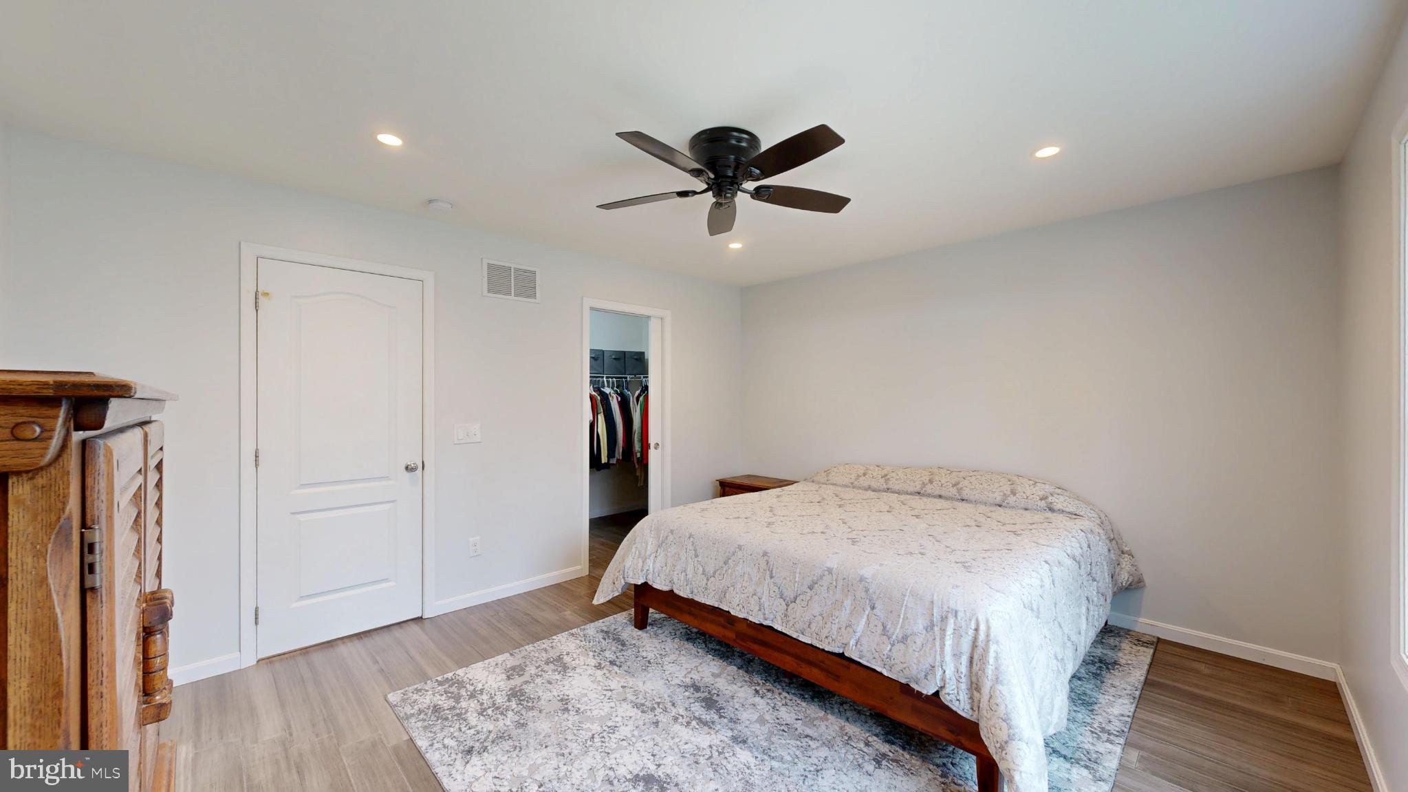 202 East Buck Point Road Clayton, DE 19938 - Photo 30 of 53 a bedroom with a bed and a chandelier