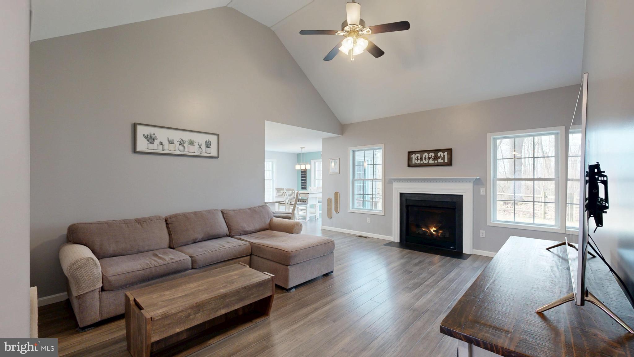 202 East Buck Point Road Clayton, DE 19938 - Photo 4 of 53 a living room with furniture and a fireplace