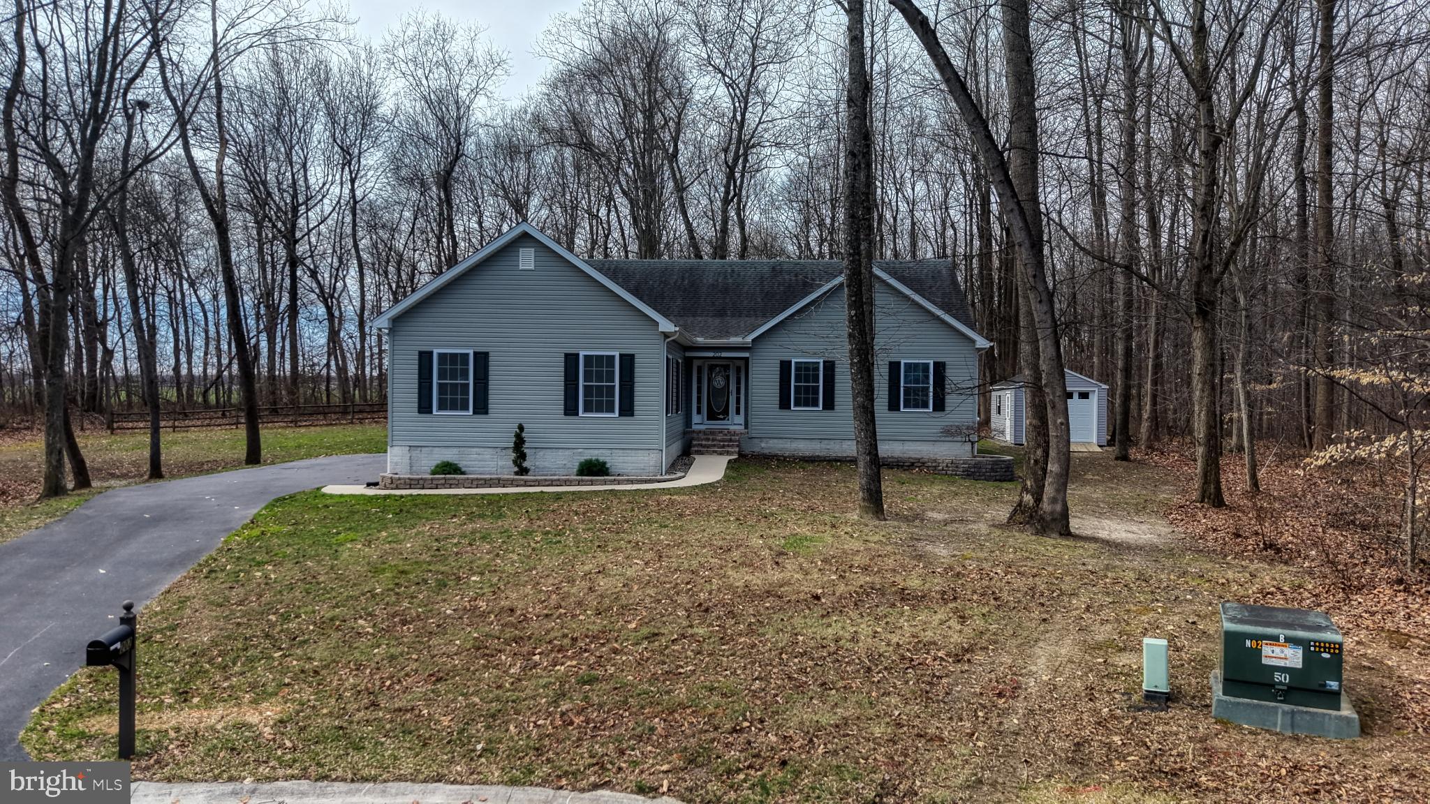 202 East Buck Point Road Clayton, DE 19938 - Photo 42 of 53 a house with trees in the background