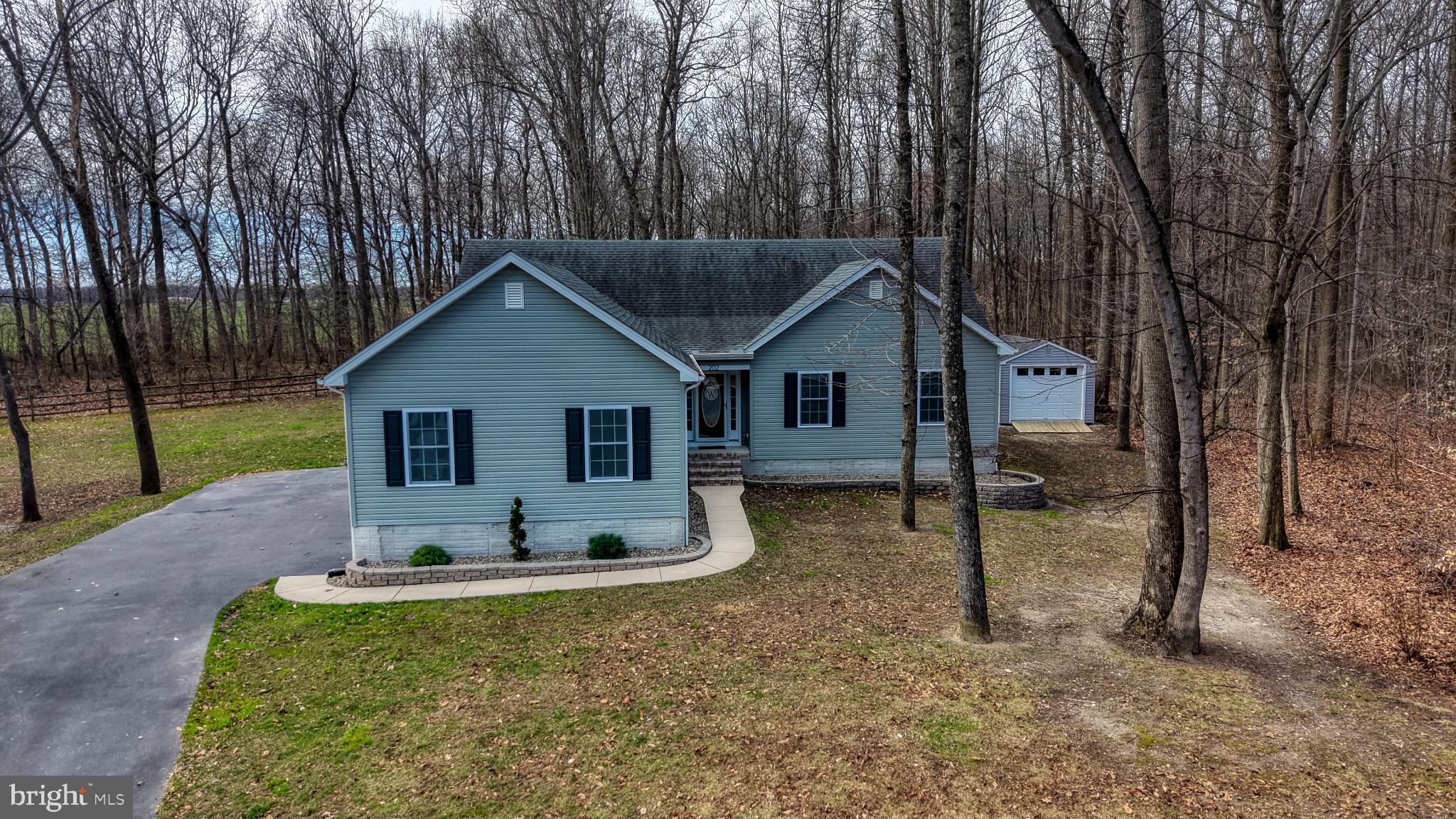 202 East Buck Point Road Clayton, DE 19938 - Photo 51 of 53 a backyard of a house with table and chairs