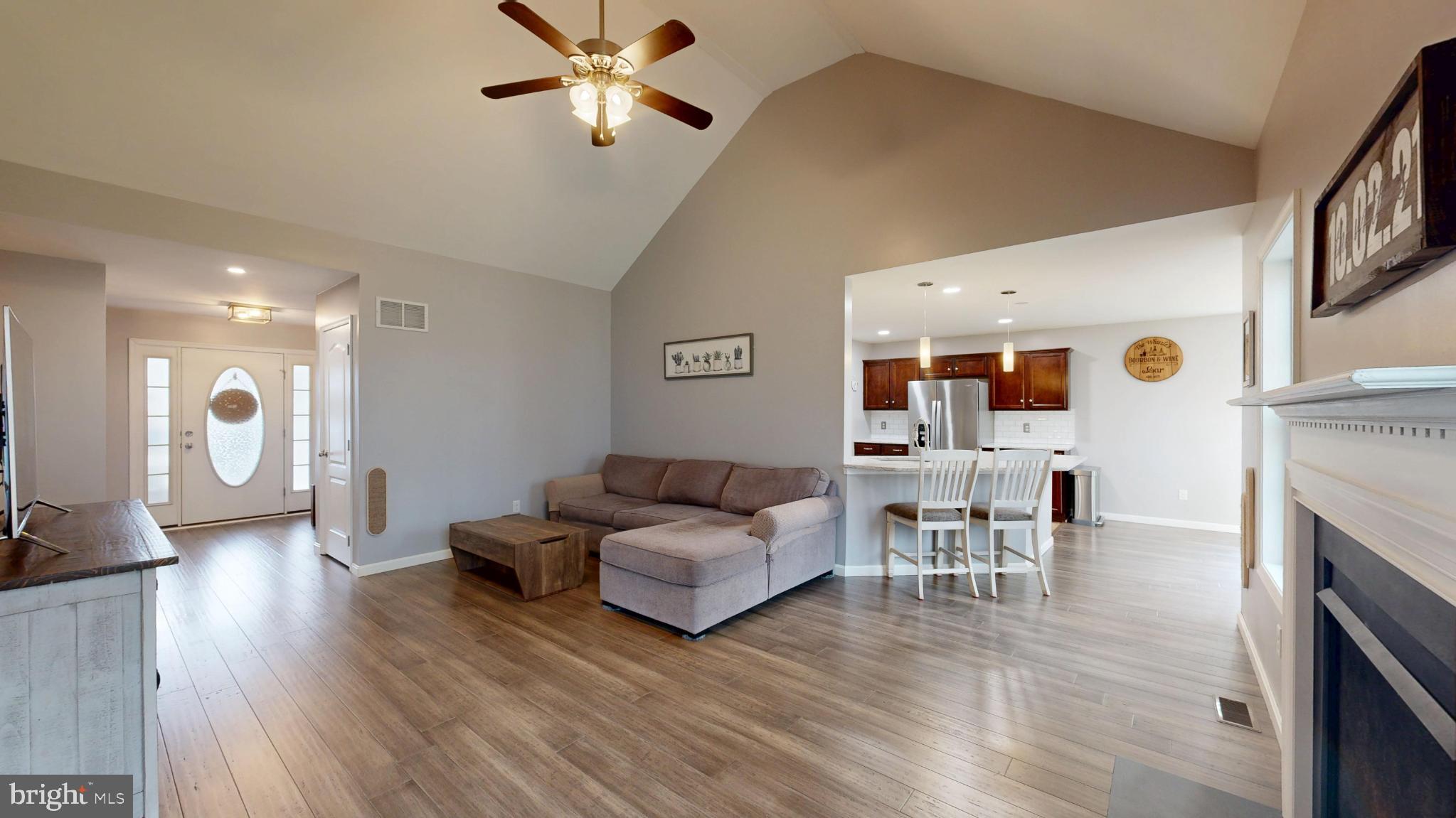 202 East Buck Point Road Clayton, DE 19938 - Photo 6 of 53 a living room with furniture and a fireplace